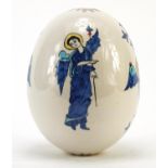Turkish Armenian Kutahya pottery suspension egg hand painted with winged figures and masks, 18.5cm