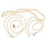 Three single string pearl necklaces including two with 9ct gold clasps, 53.5g :For Further Condition