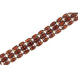 Silver and garnet three row bracelet, 18cm in length, 26.0g :For Further Condition Reports Please