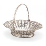 George II oval silver bread basket with swing handle, by John Langford II and John Sebille, the body