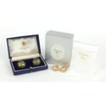 Pair of Christian Dior earrings and a pair of green stone cuff links housed in an Alfred Dunhill box