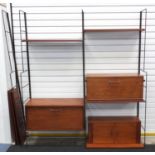 1970's modular wall unit in the style of Ladderax with shelves and three cupboards, one with