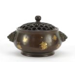 Chinese patinated bronze splashed incense burner with pierced lid and twin handles, impressed