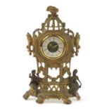 Ornate brass West German mantel clock mounted with two figures, 36cm high :For Further Condition