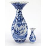 Large Japanese blue and white porcelain vase hand painted with flowers, and a smaller example, the
