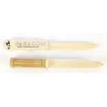 Two carved bone letter openers including one advertising Paragon Golf Construction, the largest 23cm