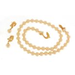 18ct gold and diamond simulated pearl necklace and earrings, the necklace 44cm in length, 49.2g :For