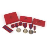 Three Elizabeth II 1953 coronation medals and a miniature with boxes including a ladies issue :For