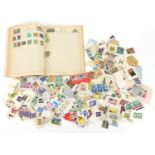 Collection of world stamps, some arranged in an album :For Further Condition Reports Please Visit