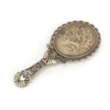 Chinese silver coloured metal pierced hand mirror, decorated with two cranes in a landscape, 13.