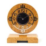 Art Deco design Dunhill birdseye maple mantel clock, the circular dial having Arabic numerals,