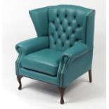 Contemporary wingback armchair with turquoise leather buttonback upholstery, 103cm high :For Further