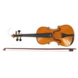 Old wooden violin with two bows having mother of pearl frogs and a fitted case, the violin back 14