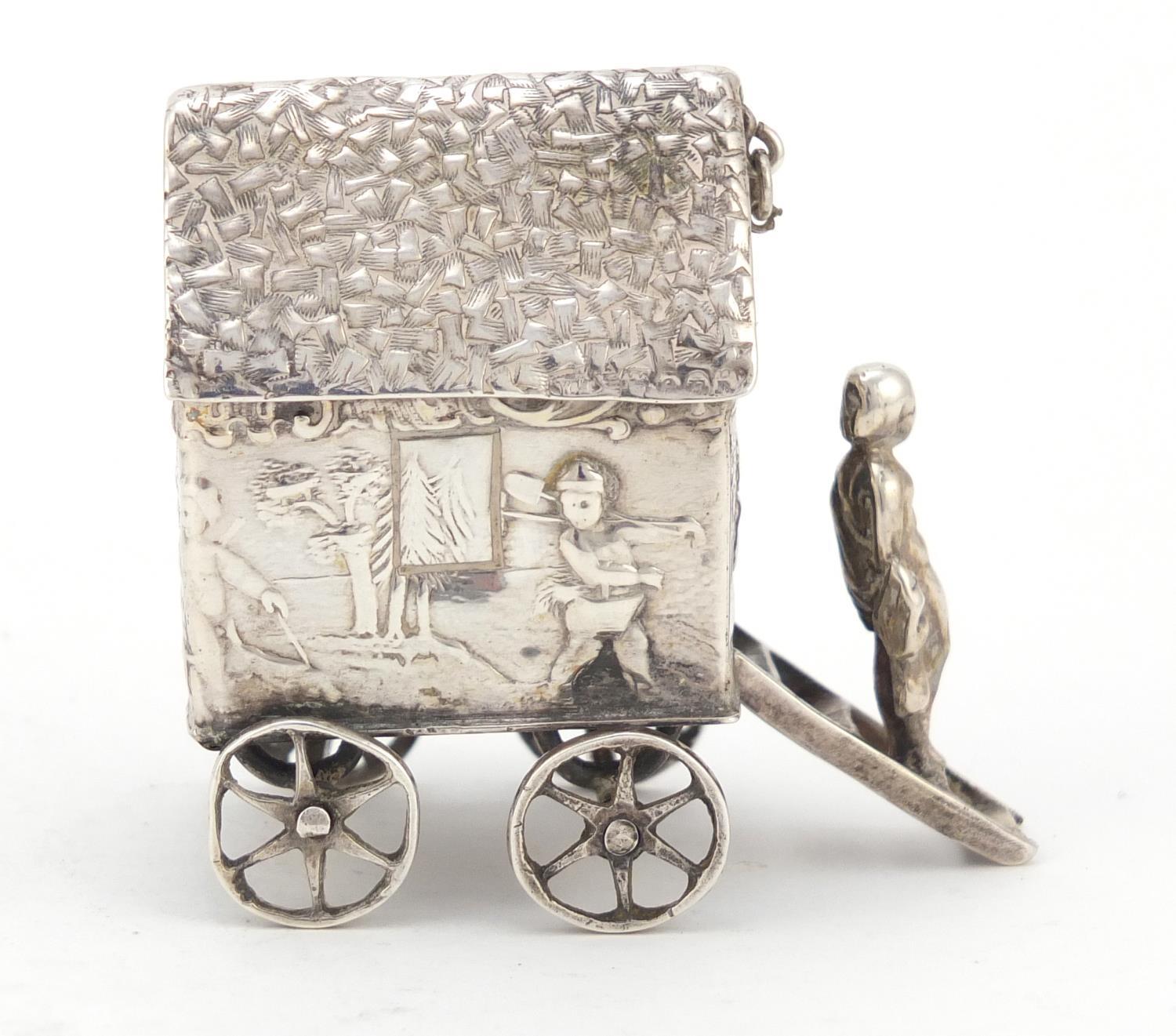 Victorian silver model of a young figure on a wagon, embossed with Putti playing, indistinct - Image 5 of 8