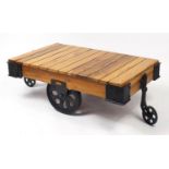 Railway interest lightwood and painted steel cart design coffee table, 44cm H x 125cm W x 71cm D :