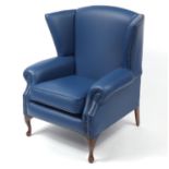 Contemporary wingback armchair with blue leather upholstery, 103cm high :For Further Condition