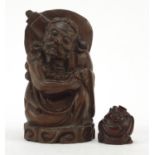 Two Chinese root carvings including one of a Buddha, the largest 15.5cm high :For Further