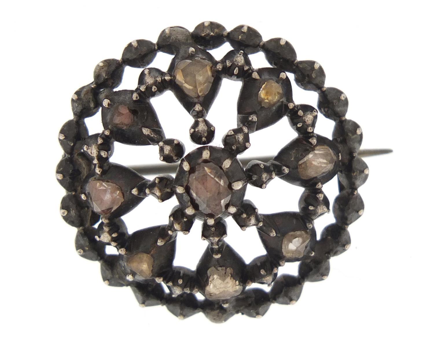 Georgian cut steel brooch, set with nine coloured diamonds, 2.5cm in diameter, 8.7g :For Further