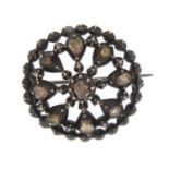 Georgian cut steel brooch, set with nine coloured diamonds, 2.5cm in diameter, 8.7g :For Further
