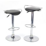 Pair of contemporary adjustable chromed stools with black faux leather seats :For Further