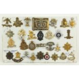 British military World War I and later cap badges and a Argyll & Sutherland Highlanders buckle