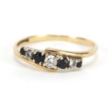 9ct gold sapphire and cubic zirconia crossover ring, size R, 1.8g :For Further Condition Reports