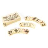 Set of carved bone playing cards housed in a box, carved with two birds and flowers, each card 3.1cm