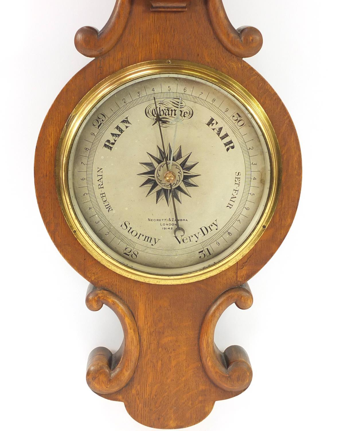 Negretti & Zambra oak wall barometer with thermometer with silvered dials, numbered 19143, 82cm high - Image 3 of 6