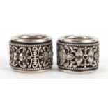 Two Chinese silver coloured metal archer's rings, each 3cm in diameter :For Further Condition