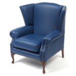 Contemporary wingback armchair with blue leather button upholstery, 103cm high :For Further