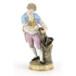 19th century Meissen hand painted porcelain figure of a young male splicing a branch to a tree, blue