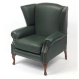 Contemporary wingback armchair with khaki green leather button upholstery, 103cm high :For Further