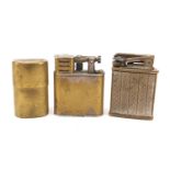 Three vintage lighters including a Dunhill example, the largest 5cm high :For Further Condition