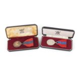 Two Elizabeth II Imperial Service medals with fitted cases awarded to Robert Young and Leslie