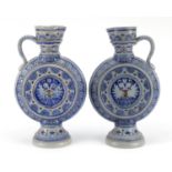 Pair of Bavarian salt glazed jugs, each numbered 566A to the bases, each 35.5cm high :For Further