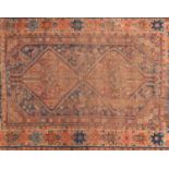 Rectangular Persian rug with two medallions, having an all over animal and flower design onto blue