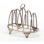 George V silver four slice toast rack by William Comyns & Sons, London 1914, 10cm wide, 68.3g :For