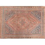 Rectangular Persian rug with central medallion, having an all over floral design onto blue and red