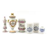 Six Italian pottery apothecary jars including three hand painted with flowers, the largest 30cm high