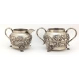Indian silver coloured metal silver coloured bowl and milk jug embossed with farmers and cattle, the