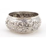 Circular unmarked Burmese silver bowl embossed with deities, 10cm in diameter, 82.8g :For Further