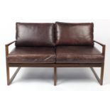 Contemporary Scandinavian design York two seater settee with brown leather upholstery, 79cm H x