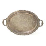 Heavy silver plated serving tray with twin handles, engraved with flowers, 69.5cm wide x 42.5cm deep