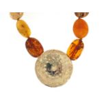 Natural and Baltic amber necklace with unmarked gold mounts, (tests as 9ct gold) 60cm in length,