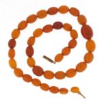 Butterscotch coloured amber bead necklace, 50cm in length, 34.0g :For Further Condition Reports