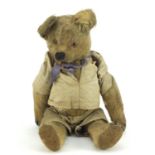 Antique golden straw filled teddy bear with jointed limbs, 30cm high :For Further Condition