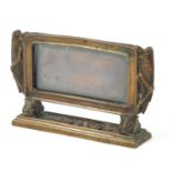 American school Arts & Crafts bronze photo frame with two locusts, initials MV to the base, 10.5cm