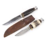Two military interest Commando knives, one with leather sheath, the largest 24cm in length :For