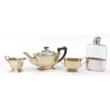 Silver plate comprising oversized glass hip flask by JDS & Sons and three piece teaset, the