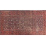 Rectangular Persian Bashir rug having an over repeat flower head design, 241 cm x 130cm :For Further
